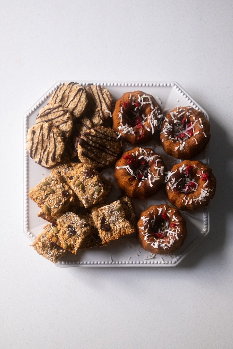 Assorted dessert platter with cookies, mini bundt cakes, and granola bars