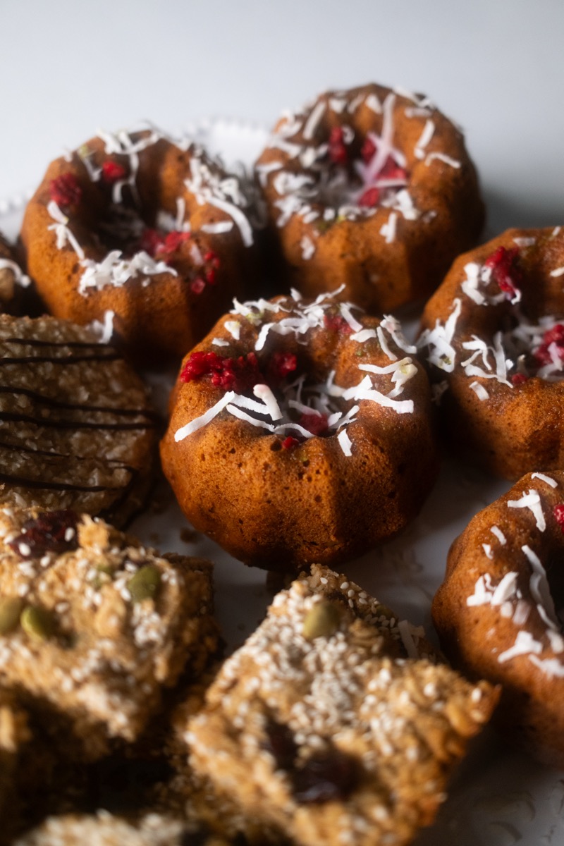 Mini bundt cakes topped with coconut and dried berries