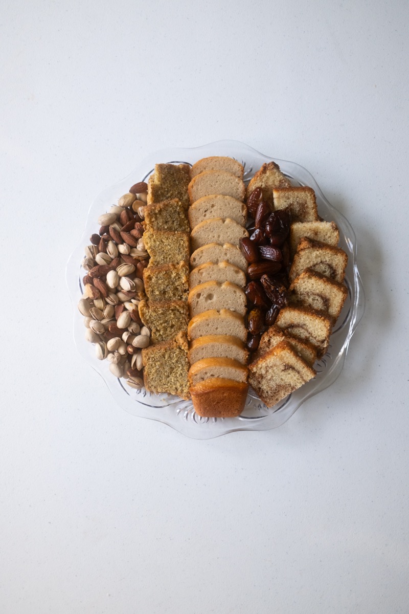 Sweet bread and cake platter with pistachios and dates